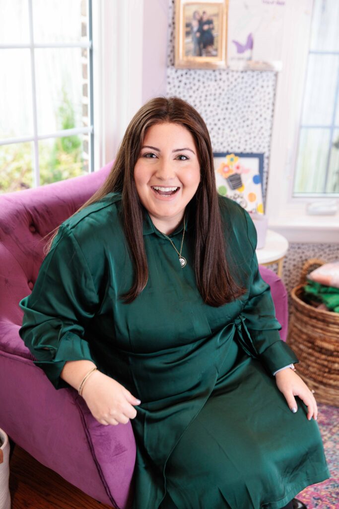 Plus size model smiling in chair