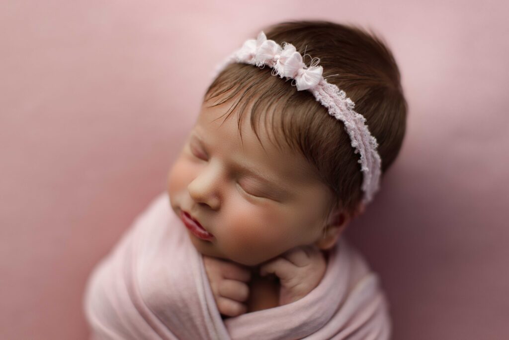 Skokie Newborn in pink close up by a photographer