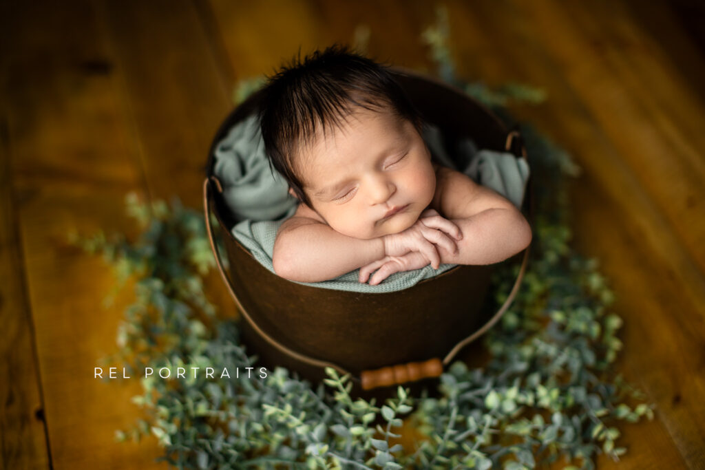 Skokie Newborn Photography of baby bow in bucket