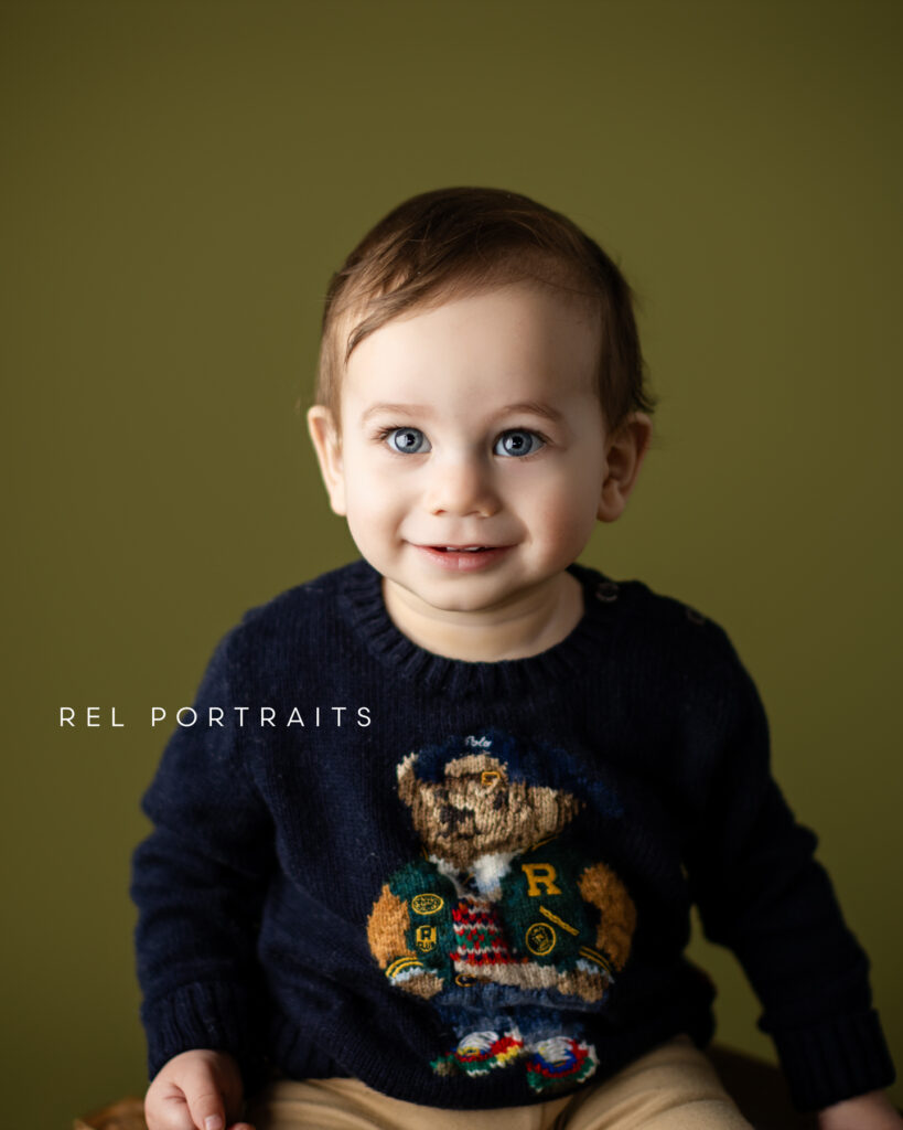 Baby boy at milestone session in green