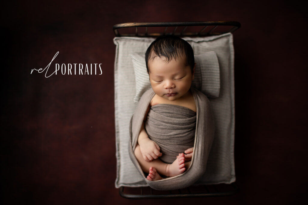 photoshoot of baby boy in chicago on bed