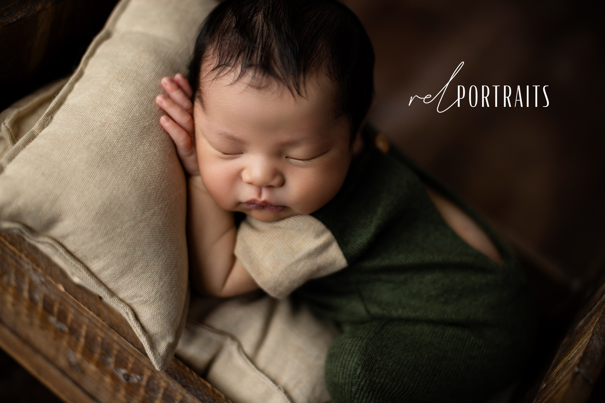 photoshoot of newborn baby boy on pillow