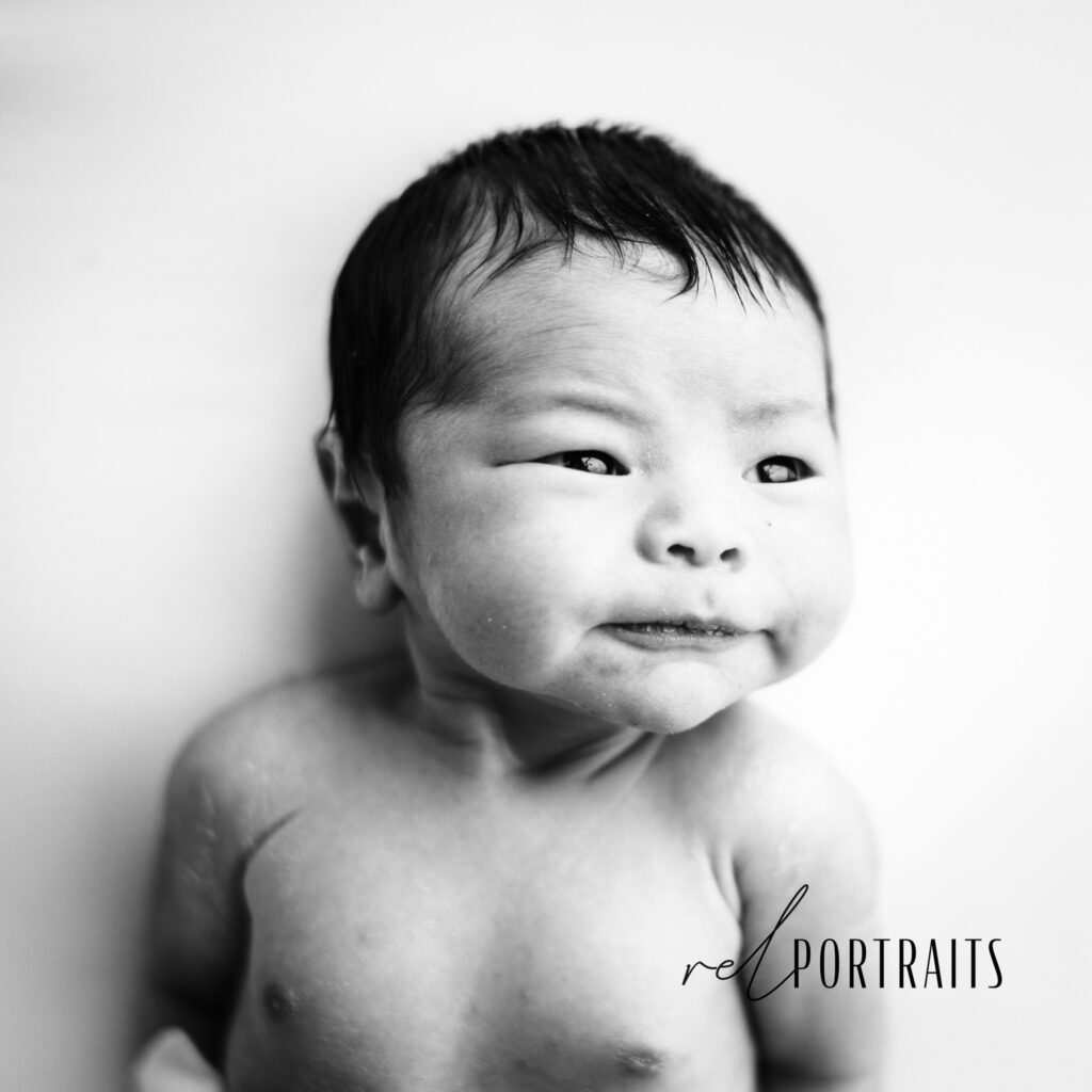 photoshoot of newborn with big cheeks in chicago