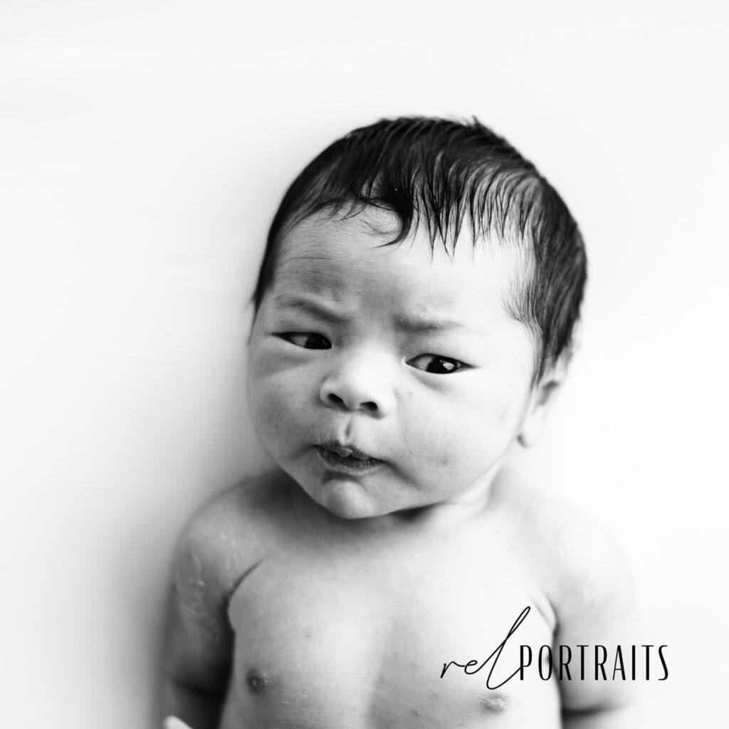 confused newborn baby in black and white in chicago