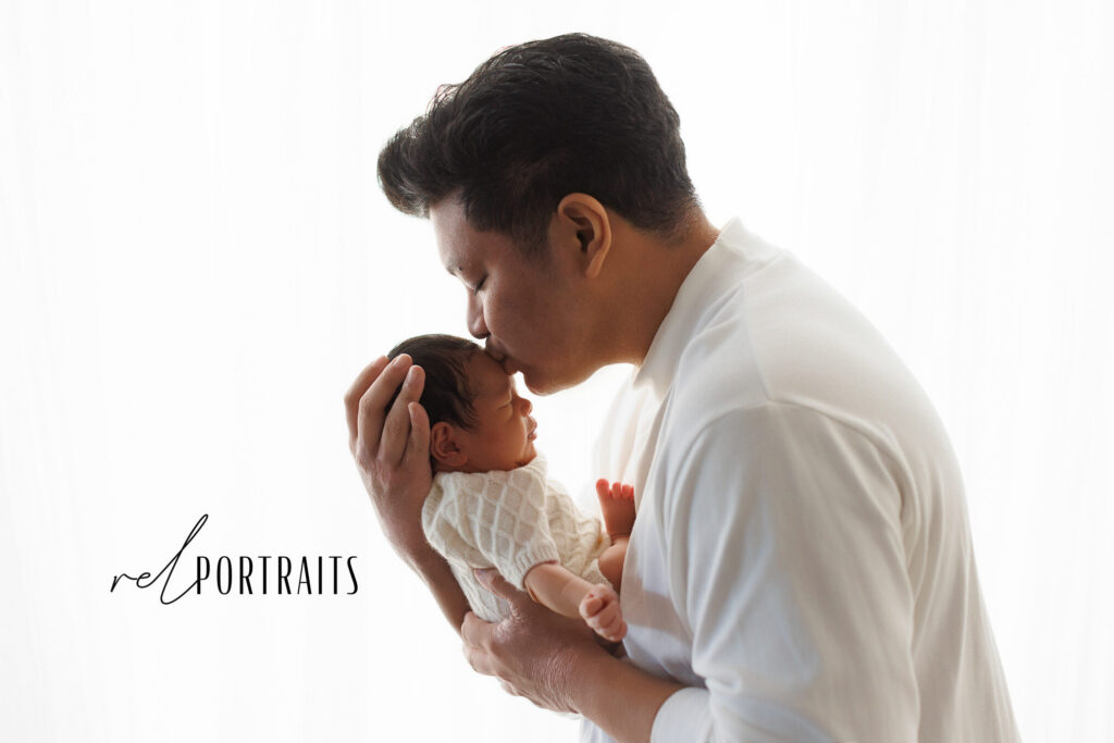 baby boy and dad at newborn photoshoot