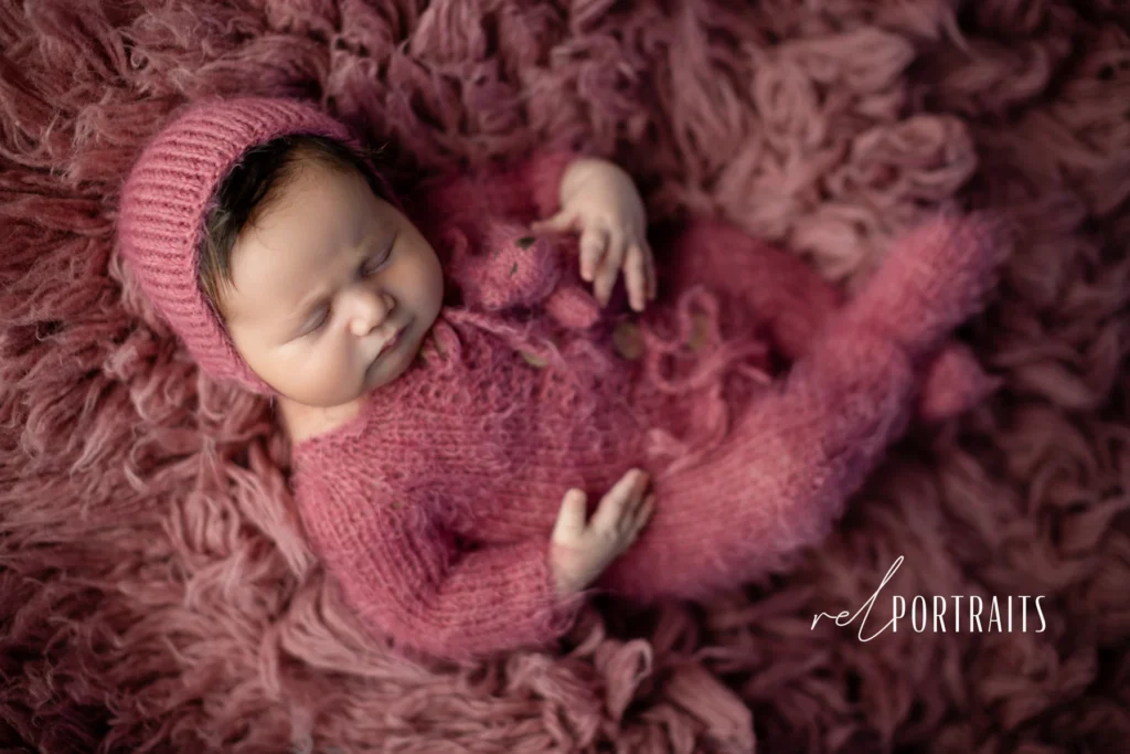 baby girl in pink outfit