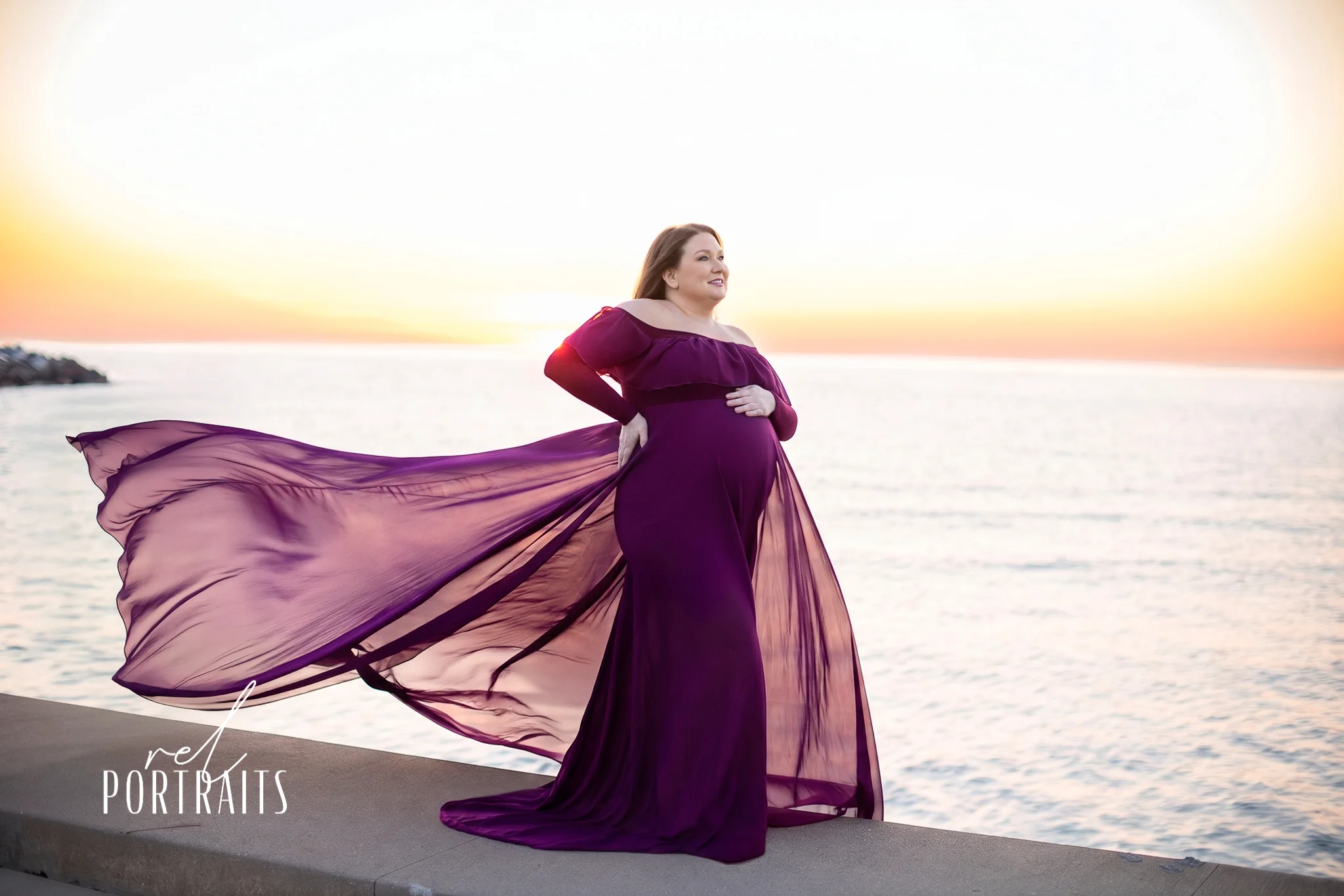 Maternity photo with purple flowing dress